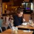 A young woman having breakfast in Munich.