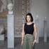 Alexandra Horn stands in front of various sculptures in the Glyptothek in Munich.