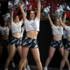 Several cheerleaders of FC Bayern Basketball in Munich cheer by dancing.