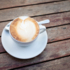 A cappuccino on a wooden table in Munich