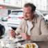 Michelin-starred chef Benjamin Chmura is sitting on the terrace of the Chinese restaurant Fuyuan in Munich eating a soup.