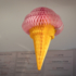 A waffle with a scoop of paper ice cream hangs from the ceiling of an ice cream parlour in Munich.