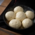 Dampfnudeln (Steam noodles) are prepared in a pan.