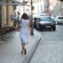 Woman in a white skirt walking in the district Schwabing in Munich.