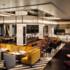 The lobby of the Rosewood Hotel with many different seating options in autumn colours.