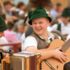 Two musicians in traditional costume at the Oide Wiesn in Munich.