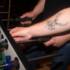 A deer tattoo on the forearm of a table football player in the pub Südstadt in Munich.