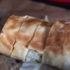 A baked strudel dough lies on a baking tray