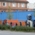 People stand in front of a painted wall in the slaughterhouse district