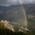 Rainbow in front of mountains in summer in the surrounding area of Munich.