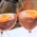 Two cocktail glasses with rosé, orange slices and ice in a Munich bar