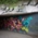 View into an underpass in Munich, which is decorated with graffiti and street art.