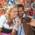 A couple is taking a selfie in front of gingerbread hearts at the Oktoberfest in Munich.