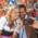 A couple is taking a selfie in front of gingerbread hearts at the Oktoberfest in Munich.