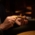 A man lights a cigar with his lighter
