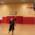 A woman throws the ball into the basket in a basketball hall of the FC Bayern Basketball team in Munich