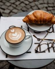 Coffee and a croissant in a café in Munich.