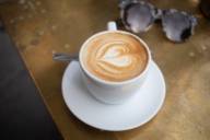 Cappuccino and sunglasses in a café in Munich.