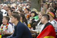 A group of fans of the German national football team join in the excitement at a public viewing in a Munich beer garden.