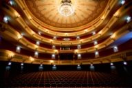 Panoramic view of an illuminated empty auditorium of the Gärtnerplatztheater in Munich.