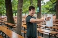 Man lifts a 3-liter mass mug in the Hirschgarten in Munich.