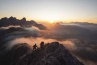 Two hiker are on a mountain ridge near Munich.