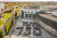 Students form the writing "TUM 150" in Munich