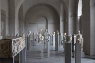 View into a museum with many antique statues in Munich.