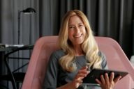 A woman with a tablet in a hotel in Munich.