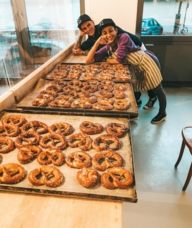 Leyla Kazim bakes pretzels in a bakery.