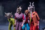 Actors dressed as animals on a stage