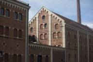 The historic building of the Augustiner Brewery is made of red brick.