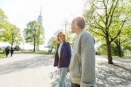 A woman and a man are going through the Olympic Park in Munich.