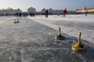 Curling on the canal in front of Nymphenburg Palace in Munich in winter.