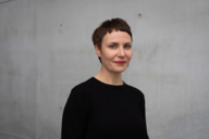 Curator Judith Csiki in front of the Pinakothek der Moderne in Munich.