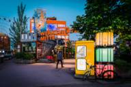 The colourfully lit entrance to the Werksviertel in the evening