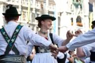 Traditional Bavarian dancers in front of New Town Hall at Munich Marienplatz
