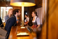 A man and a woman are checking in at a hotel in Munich.