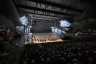 View of the stage of a concert hall during a concert.