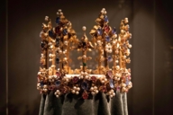 Golden crown with countless gemstones and pearls in the Residence Museum in Munich.