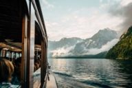 Boat trip at the Königssee with panoramic view of the Alps in the surroundings of Munich. 