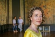 Close-up of a woman with curly hair in Villa Stuck in Munich. 