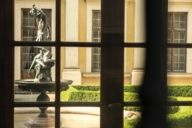 Fountain in Grottenhof of the Residenz photographed through a window of the Residenz in Munich.