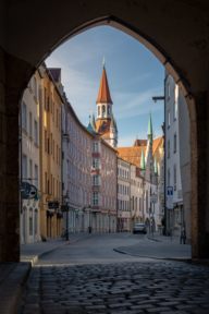 Archway with historical old town in the background in Munich.