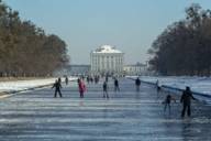 Ice scaters on the canal of Schloss Nymphenburg in Munich.