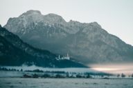 Neuschwanstein Castle in fog in the surrounding region of Munich.