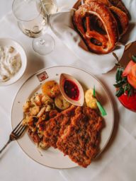 Schnitzel with potatoes and pretzel served at Spatenhaus.