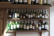 A wine rack with various empty bottles in Geisels Vinothek in Munich