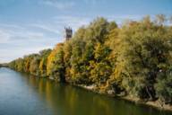 View of the Isar and Sankt Maximilian in Munich during autumn.