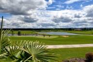 View of an extensive premium golf course in the sunshine.